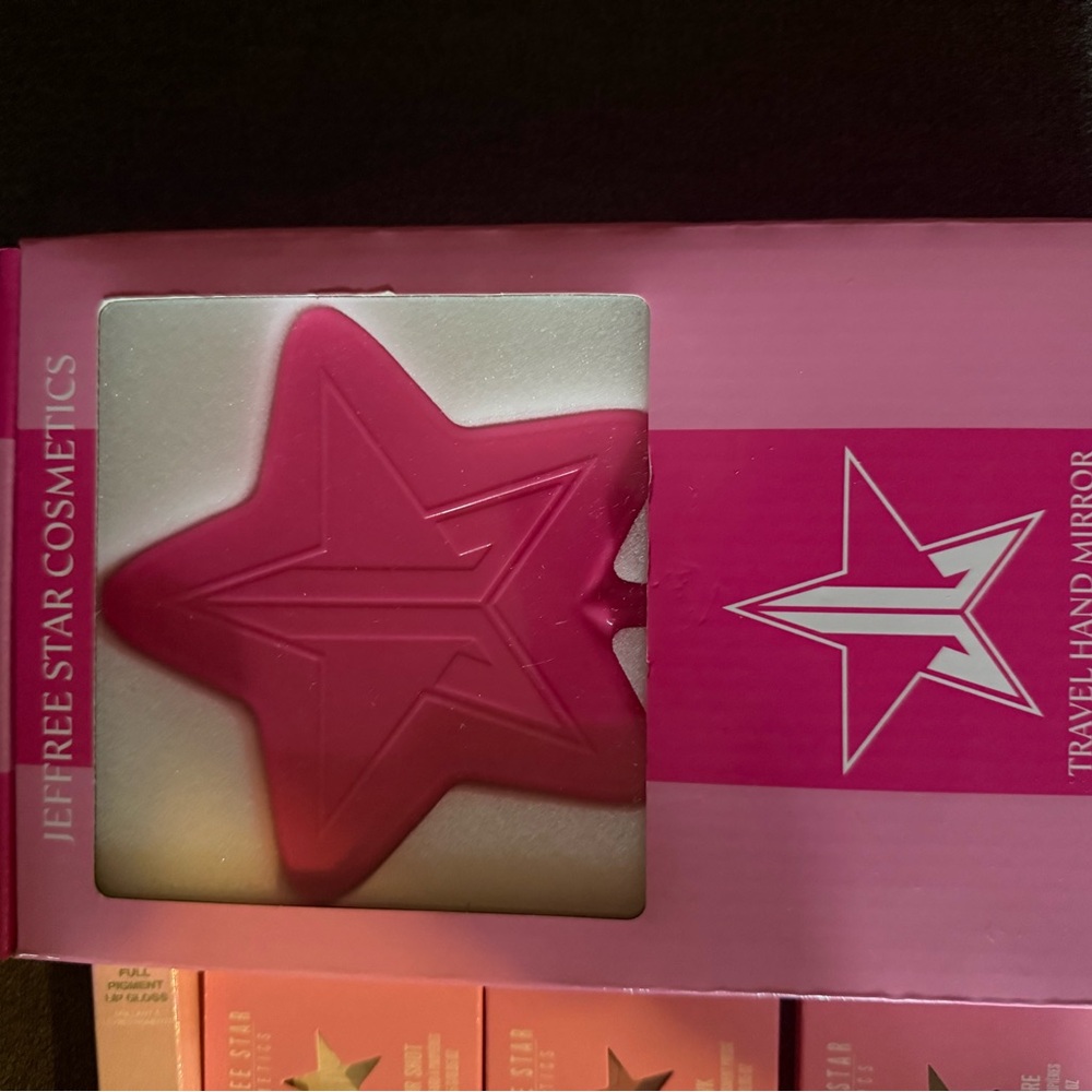 Jeffree Star Hot Pink Star Mirror with makeup and accessories seen